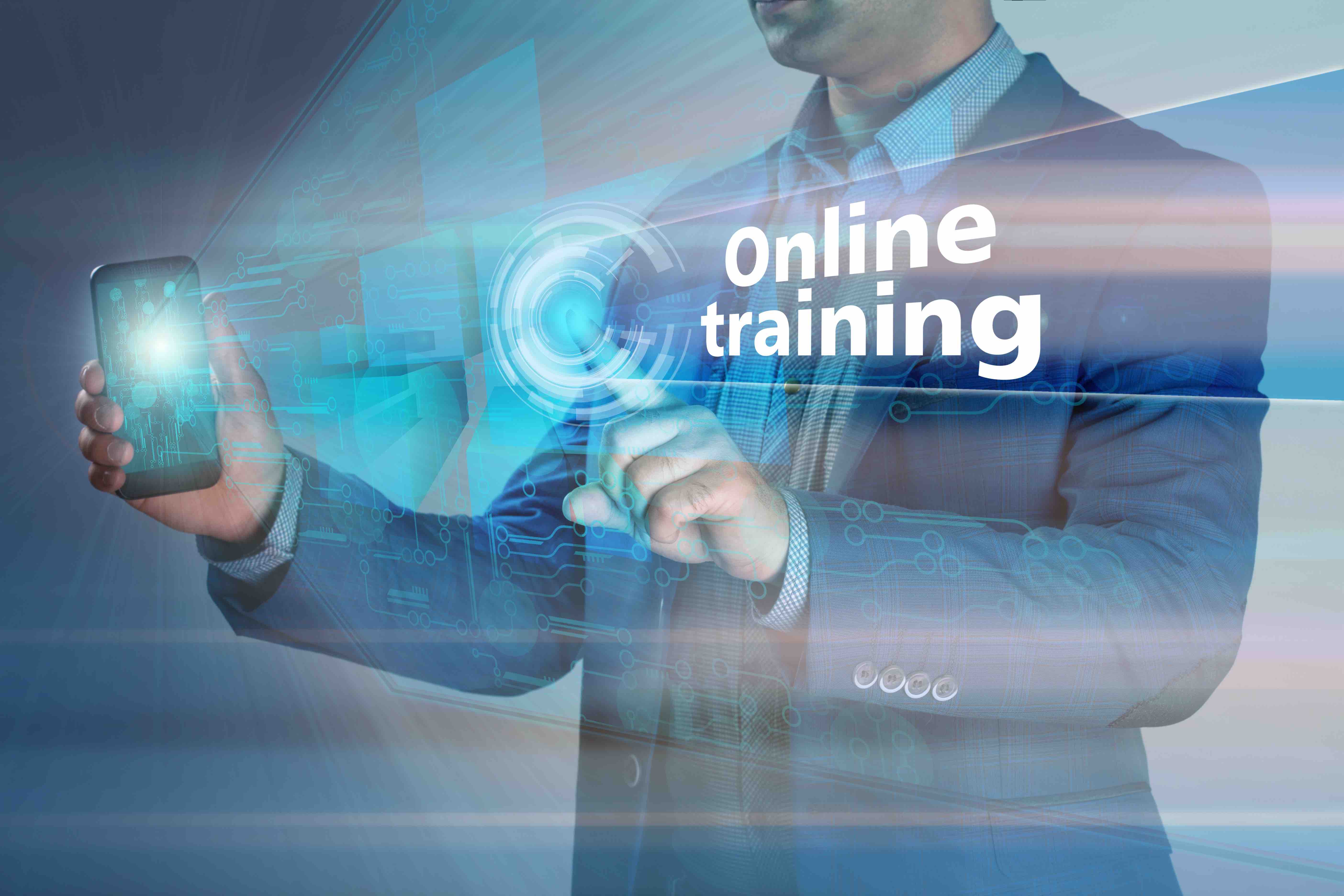 Business concept. Businessman holding smatrfon and click on the virtual display with the text online training